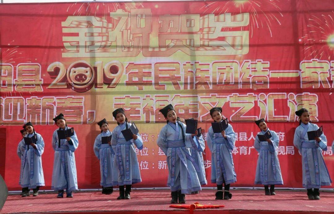 Uyghur children dressed in Han cultural clothing celebrating the year of the pig in Hotan in 2019