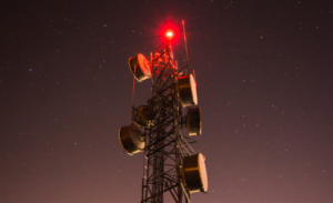 5G tower from China on the Digital Silk Road glows ominously red