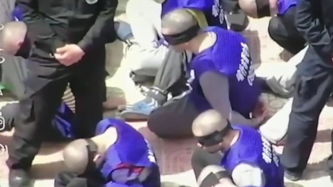 uyghurs shackled blindfolded