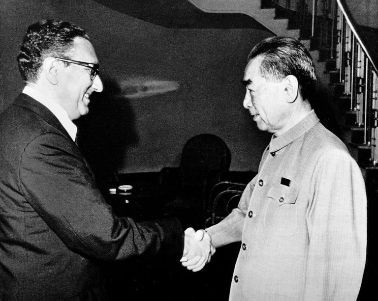 Dr. Henry Kissinger, then-Presidential National Security Adviser, shakes hands with Chinese Premier Zhou Enlai, July 1971