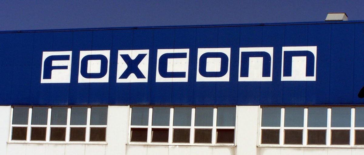 foxconn logo in blue letters on white background on blue building