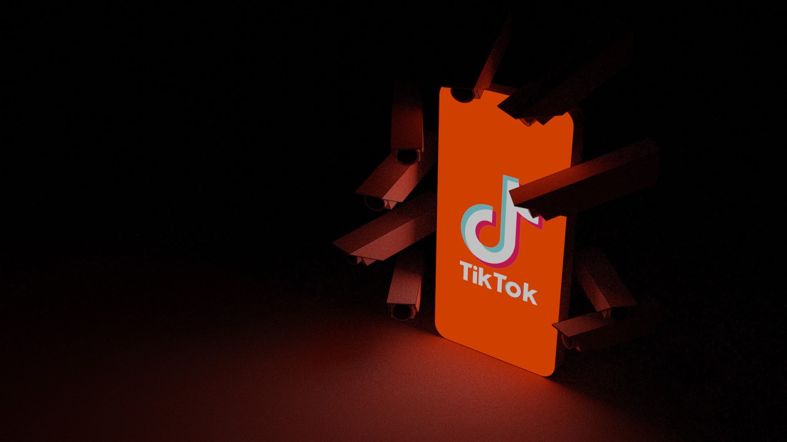 titkok orange logo on phone on black background