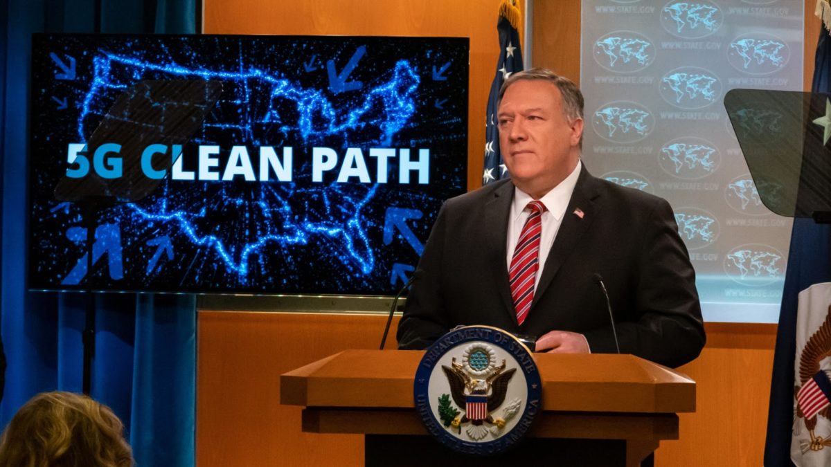 mike pompeo at a podium with a screen saying the words "5G clean path" behind him