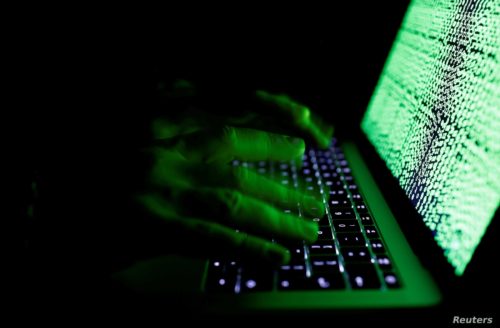 Man at keyboard depicting Chinese hacking