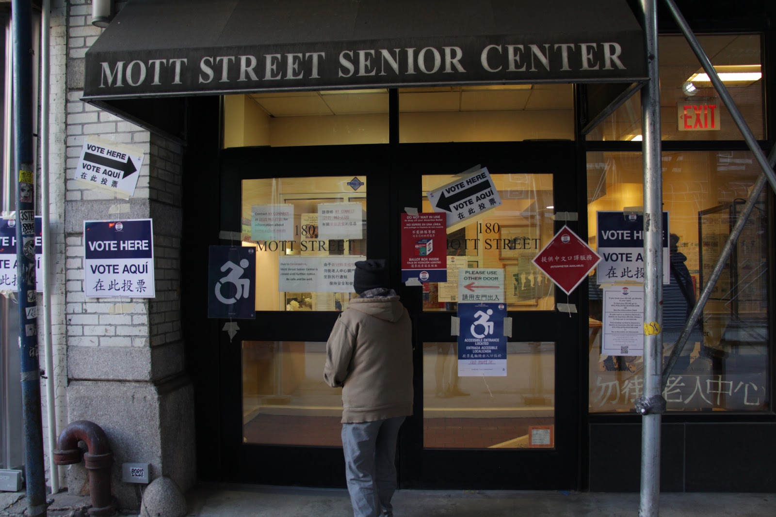 A voter visits the Mott Street polling station in Manhattan’s Chinatown 2020