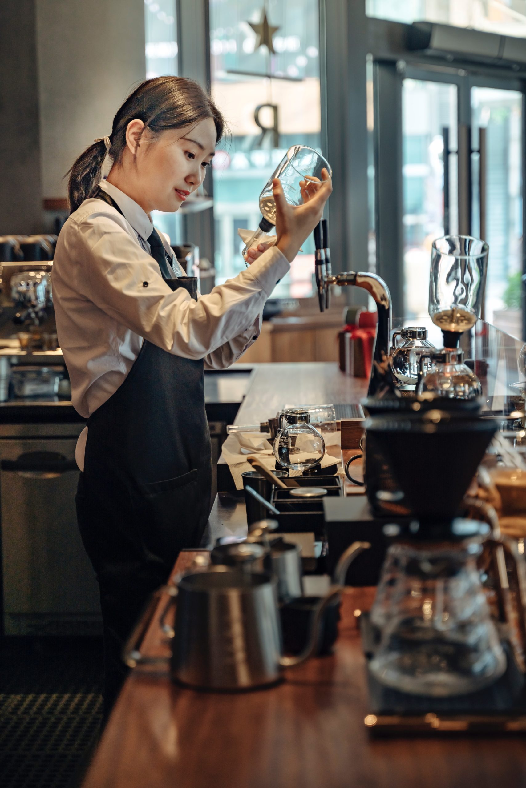 A barista preparing coffee in a Starbucks in Jiangsu, China