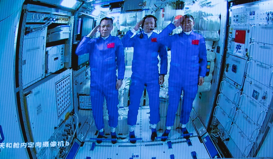a photo of three chinese astronauts