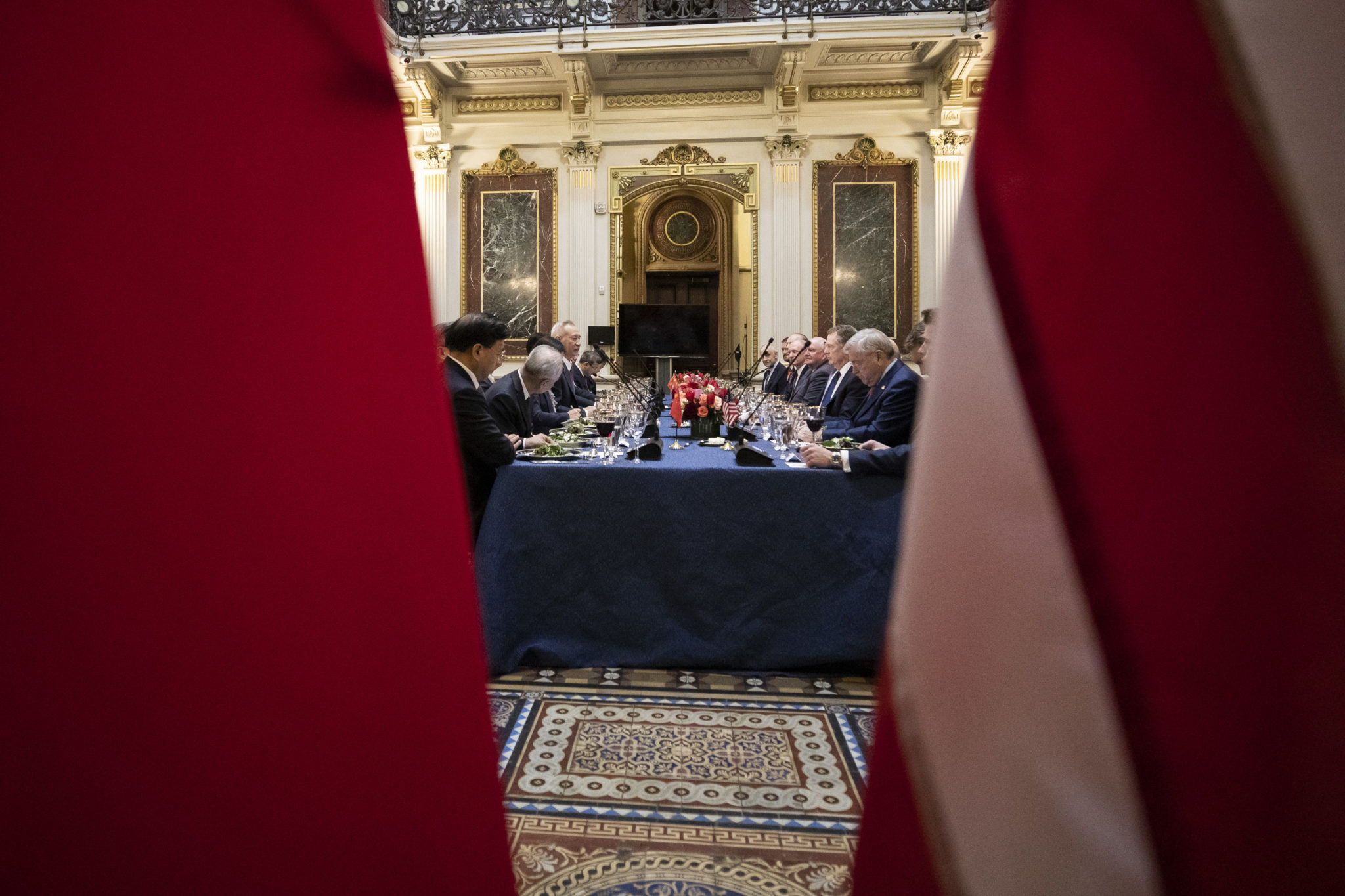 Two flags at the forefront of a dinner with representatives from China and the United States.