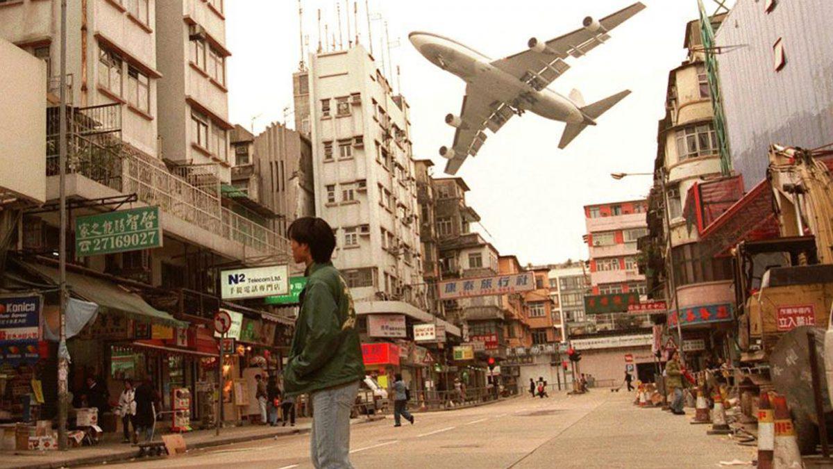 A plane soars over Hong Kong's now-closed Kai Tak Airport