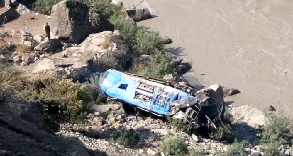 Mobile phone photo showing the wreck of a bus plunged into a ravine following a blast in Pakistan's northwest Khyber Pakhtunkhwa province on July 14, 2021