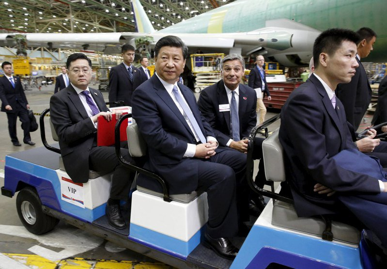 qin gang, xi jinping, and others touring a boeing factory