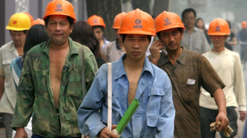 chinese migrant workers wearing hard hats